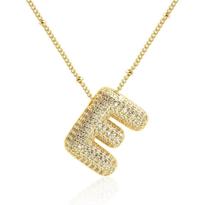 Close-up of golden letter E pendant with white cubic zirconia pavé on cross chain