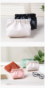 Detailed view of colorful PU leather cosmetic bags with elastic closure and soft texture