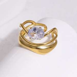 Detail of 18k gold plated ring with large oval purple zircon on geometric stone