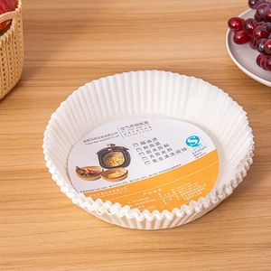 Detail of 160mm round air fryer paper liners with heat-resistant fluted edges