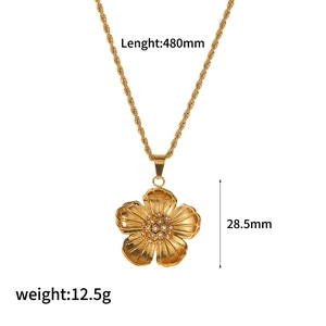 Elegant gold flower necklace with rhinestone center on twisted chain, 480mm length