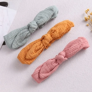 Three-piece set of soft muslin cotton baby headbands with rabbit ear bows in assorted colors