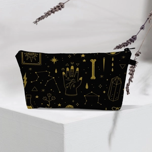 Waterproof toiletry bag with golden mystic astrology patterns on black background