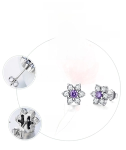Macro detail of S925 sterling silver flower earrings with purple and white cubic zirconia