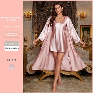 Detail view of pink imitation silk two-piece sleepwear set with smooth satin finish