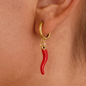 Golden round earrings with red chili pendants displayed on a model for a chic look