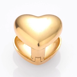 Polished gold heart-shaped stainless steel clicker earring with hinge on white background
