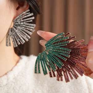 Luxe geometric fan-shaped earrings with colorful rhinestones on a female model