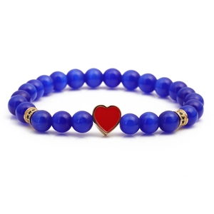 Blue cat-eye stone beaded bracelet with red heart pendant and gold spacer beads