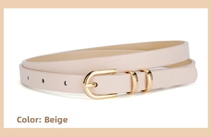 Detail of a thin beige leather dress belt featuring a gold U-shaped pin buckle design