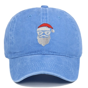 Detail of Santa Claus embroidery on light blue washed cotton baseball cap with sturdy stitching
