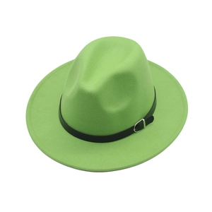 Detailed close-up of bright green wool fedora hat featuring a black leather belt strap