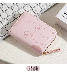 Pink PU leather card holder featuring a cute bear print and lovely text on a desk