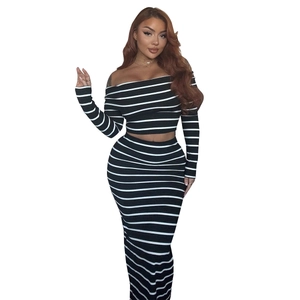 Women's black and white striped two-piece set with off-shoulder crop top and slim maxi skirt