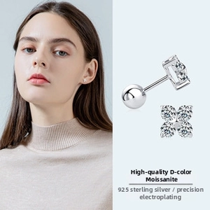 Macro view of flower-shaped D-color moissanite earrings in 925 sterling silver