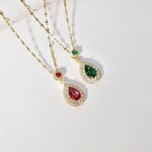 Elegant gold chain necklace with red and green teardrop pendants and micro-pave crystals