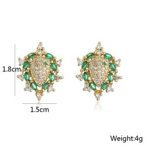 Detailed view of 18K gold plated radial earrings with green marquise and white zircons