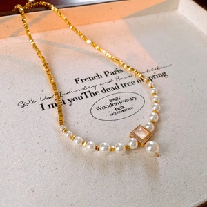 18k gold plated irregular square necklace featuring white pearls and a shell pendant