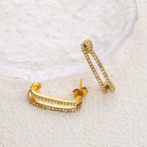 Detailed macro view of 18K gold plated rectangular earrings with double-row zircon pavé