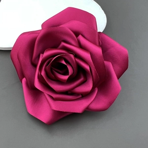 Macro detail of deep pink satin camellia flower with elegant silk texture and petals