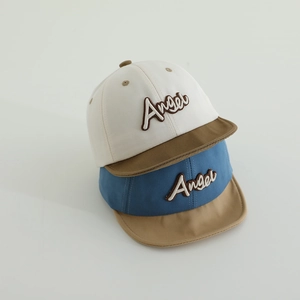 Detail of Angel embroidery and breathable cotton texture on color-block kids' caps