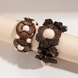 Vintage bohemian coconut shell and wood bead bracelet set with a floral charm