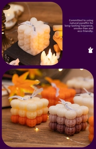 Macro detail of pumpkin and skull shaped candles made of natural paraffin for Halloween