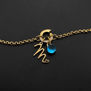 Gold-plated titanium steel letter M pendant with blue gemstone charm accessory
