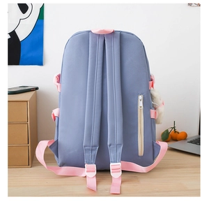 Rear view of purple school backpack showing anti-theft zipper pocket and padded straps