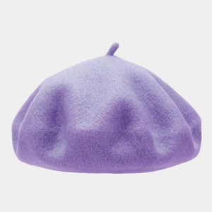 Detail of the high-quality dark purple wool felt beret with a classic top stalk