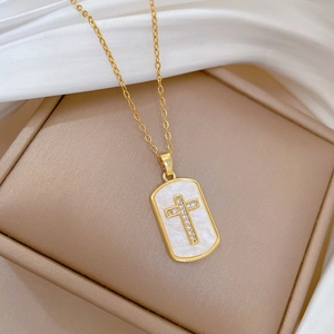 Titanium steel necklace with shell cross pendant on white silk and jewelry box