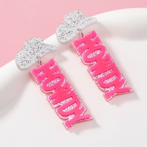 Detail of glitter silver cowboy hat earrings with pink HOWDY acrylic lettering