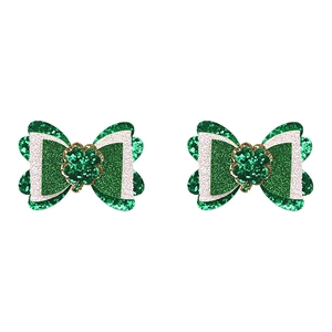 Detail of St. Patrick's Day glitter hair clips with green shamrock and bow design