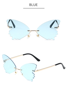 Detail view of butterfly rimless blue lenses with scalloped edges and gold metal temples
