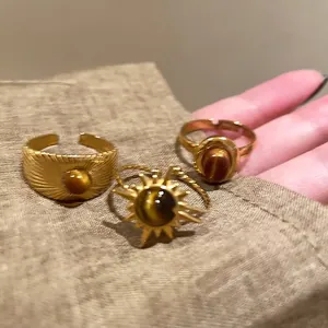 Vintage gold tiger eye ring set with solar patterns and oval minimalist designs