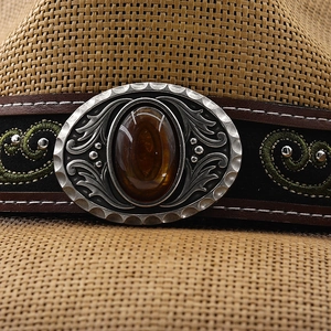 Detailed macro view of the vintage hatband with floral embroidery and silver oval buckle