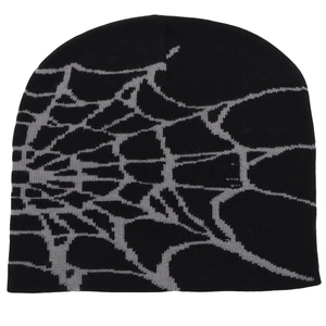 Detail of gray spider web jacquard pattern on a black knit winter beanie for street style