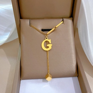 Minimalist gold titanium steel necklace with square and letter G pendant in display box
