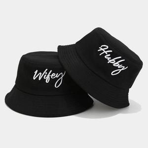 Matching black cotton bucket hats with white Wifey and Hubby embroidery for couples