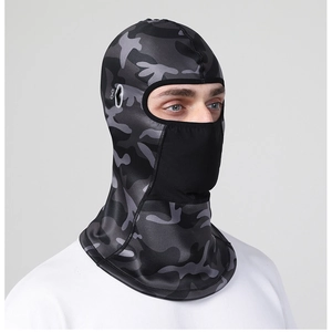 Close-up of camo cycling mask featuring side holes for eyewear and breathable fabric