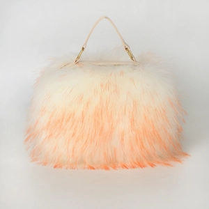 Detail of white and orange faux fur texture and golden metal handle attachments