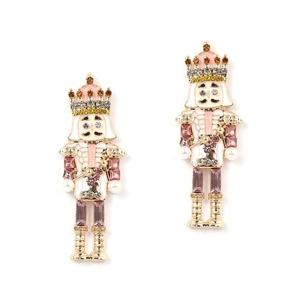 Close-up of pink nutcracker earrings with imitation pearls and colored crystals