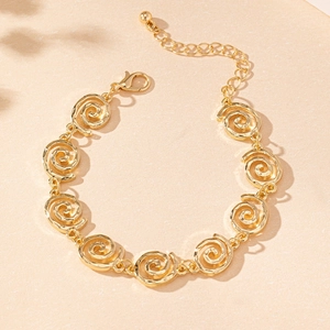 Detail view of gold spiral link bracelet with adjustable chain and lobster clasp closure