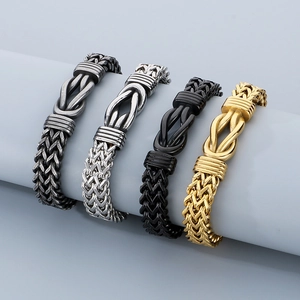 Men's hip hop Cuban chain bracelet set in silver, gold, and black colors on display