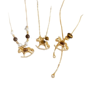 Vintage rocking horse necklaces with tiger eye, pearls and cubic zirconia on gold chains