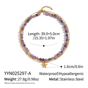 Detail of double-layer necklace with amethyst beads and starfish pendant in stainless steel