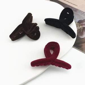 Three-piece set of velvet cross hair clips in dark brown, black, and wine red colors