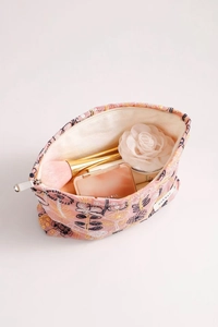 Close-up of pink floral embroidery cosmetic bag showing silver zipper and storage space