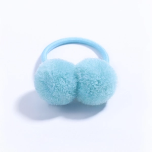 Close-up of light blue plush pompom hair tie with high-elasticity band for kids