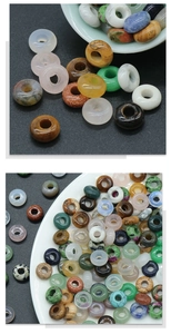 Macro view of assorted natural crystal and agate donut beads for DIY jewelry making